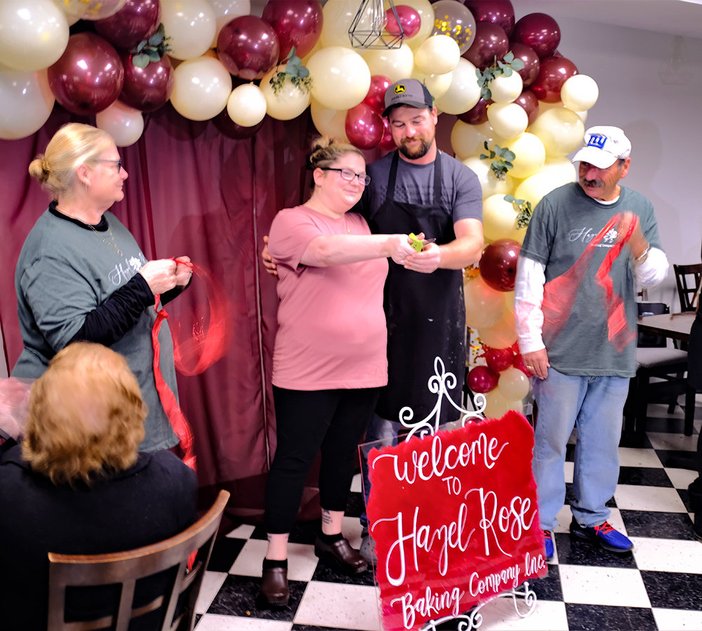 Jordan Polumbo and Jerry Murtagh cut the ceremonial ribbon to officially open the Hazel Rose Baking Company in Marlboro.